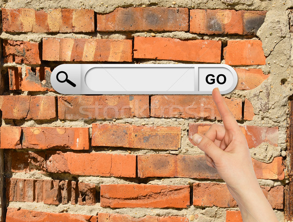 Human hand indicates the search bar in browser Stock photo © cherezoff