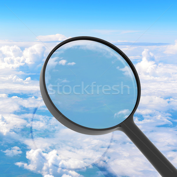 Magnifying glass looking clouds in background Stock photo © cherezoff