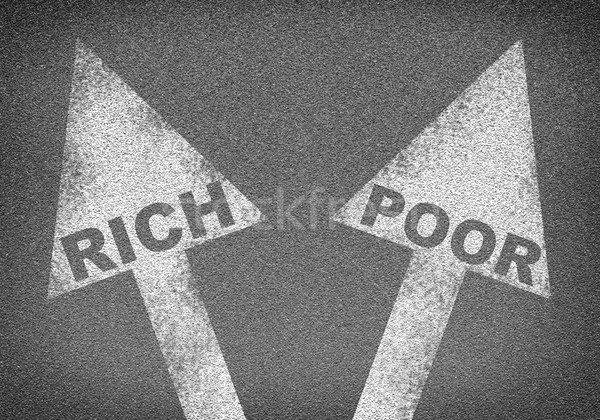 Asphalt road texture with two arrows. Words rich and poor Stock photo © cherezoff