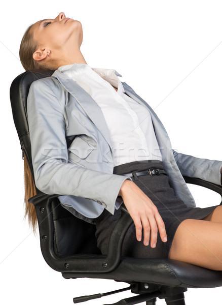 Businesswoman resting in office chair with her head thrown back  Stock photo © cherezoff