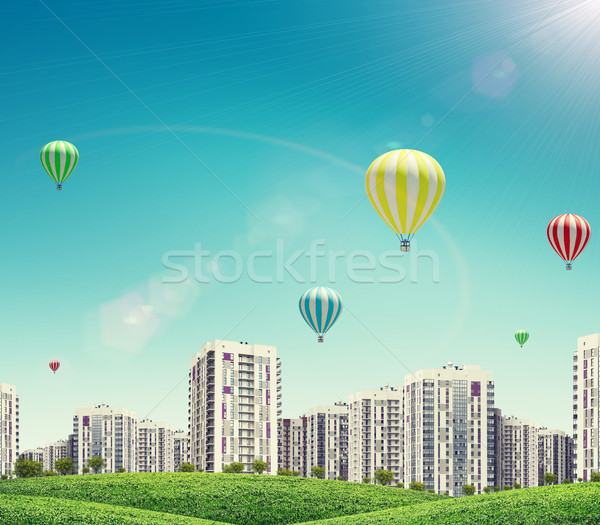 épületek levegő léggömbök dombok gyep hőlégballon Stock fotó © cherezoff
