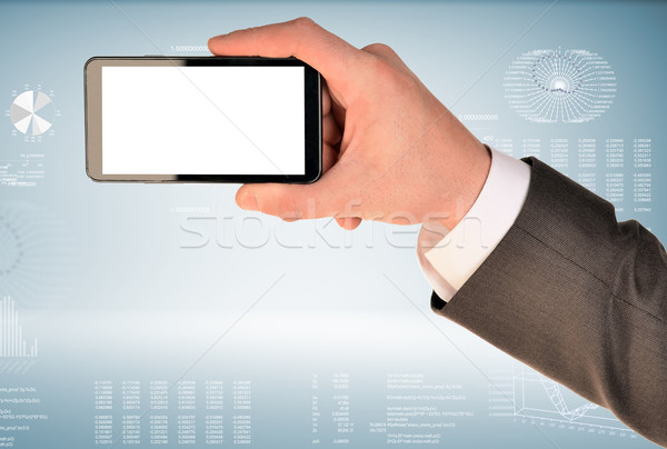 Hand hold smart phone Stock photo © cherezoff