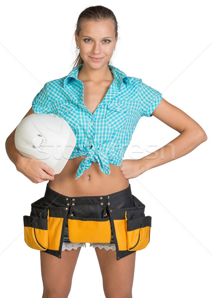 Pretty girl in shorts, shirt and tool belt holding white helmet Stock photo © cherezoff