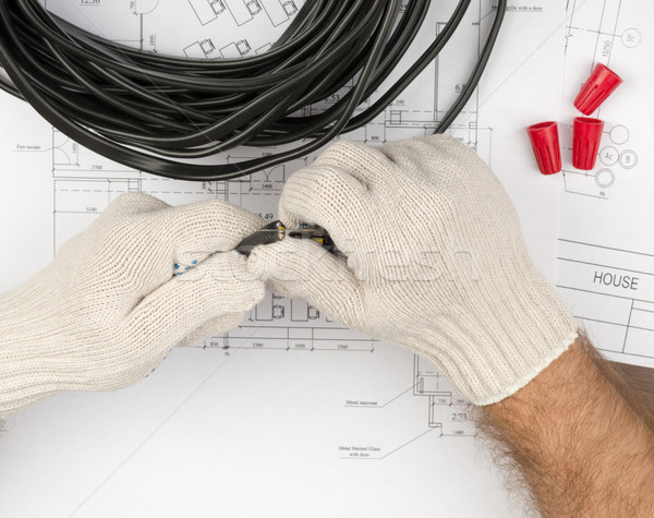 Mans hands holding black cable Stock photo © cherezoff