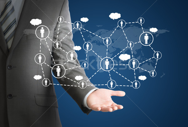 Businessman and network of contacts on hand Stock photo © cherezoff
