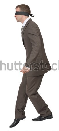 Businessman walking gingerly with band on his eyes Stock photo © cherezoff