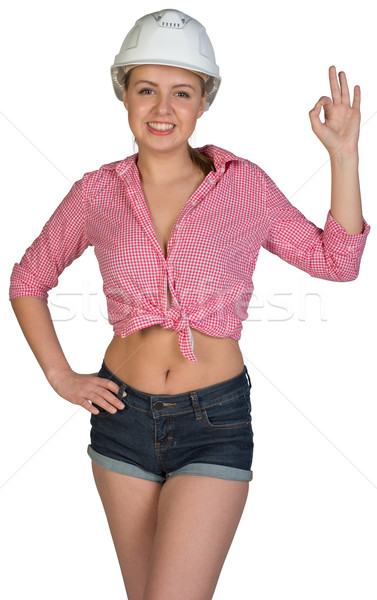 Woman in hard hat making okay gesture Stock photo © cherezoff