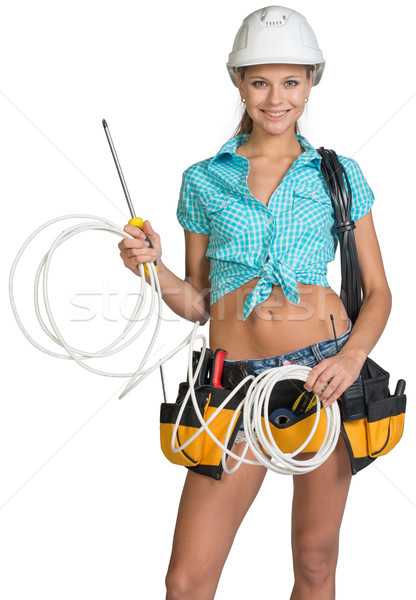 Woman in hard hat and tool belt holding coil of cable Stock photo © cherezoff
