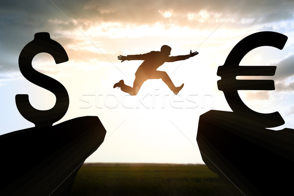 Businessman hopping over abyss  Stock photo © cherezoff