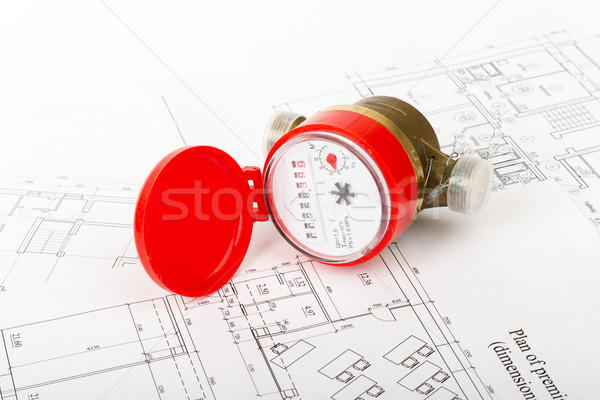 Water meter on draft, close up view Stock photo © cherezoff