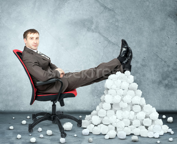 Businessman and pile crumpled paper balls Stock photo © cherezoff