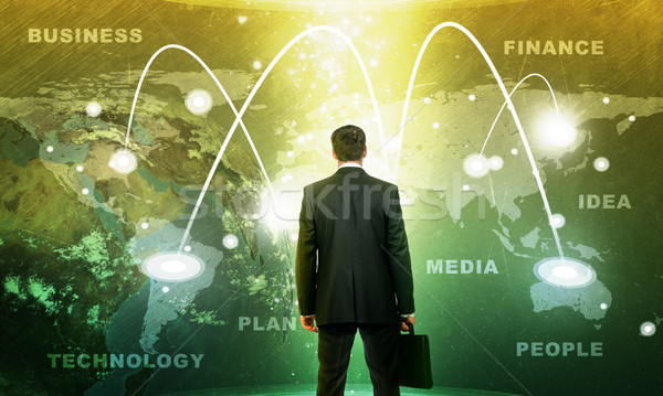 Stockfoto: Zakenman · holografische · scherm · aarde · wereldbol · business