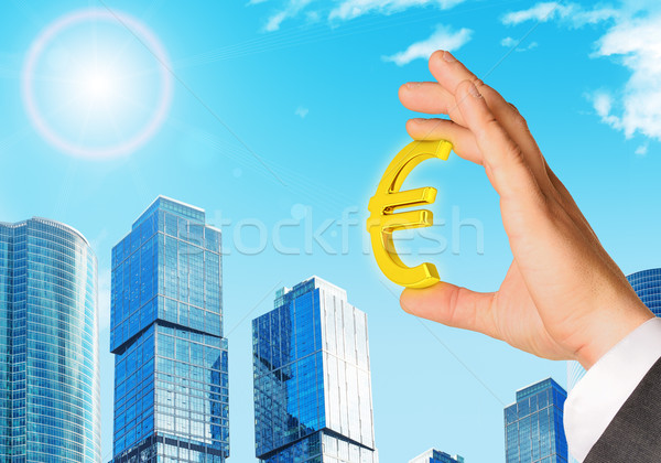 Businessman hand with euro sign Stock photo © cherezoff