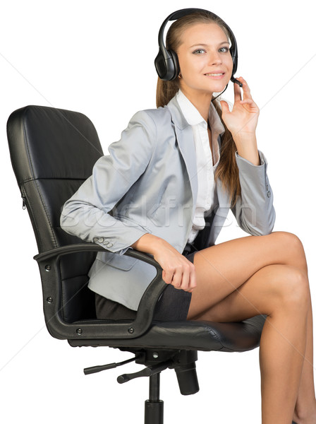 Femme d'affaires casque séance chaise de bureau doigts micro [[stock_photo]] © cherezoff