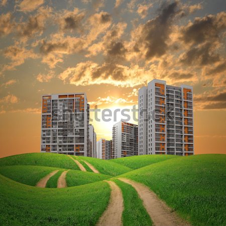 Magas épületek zöld dombok út égbolt Stock fotó © cherezoff