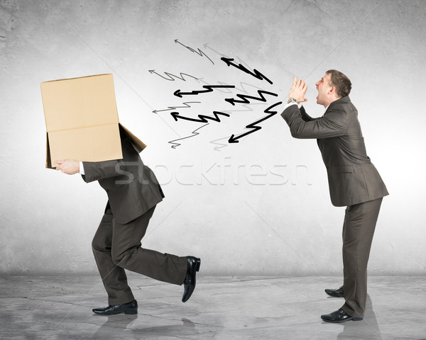 Business boss shouting to employee with box Stock photo © cherezoff