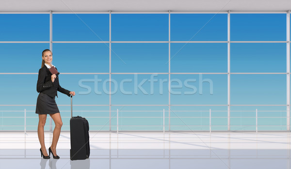 Smiling flight attendant holding passport Stock photo © cherezoff