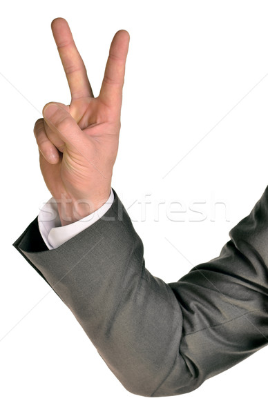 Businessman in suit shows two fingers Stock photo © cherezoff