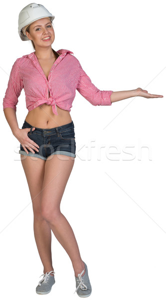Woman in hard hat showing something on her palm Stock photo © cherezoff