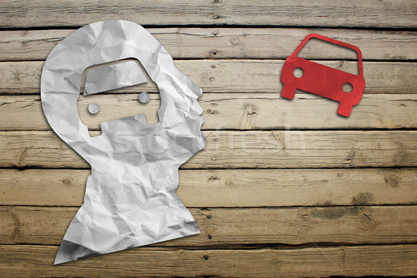 Paper humans head with car symbol Stock photo © cherezoff