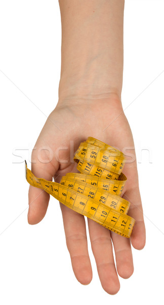 Humans arm holding tape measure, top view Stock photo © cherezoff