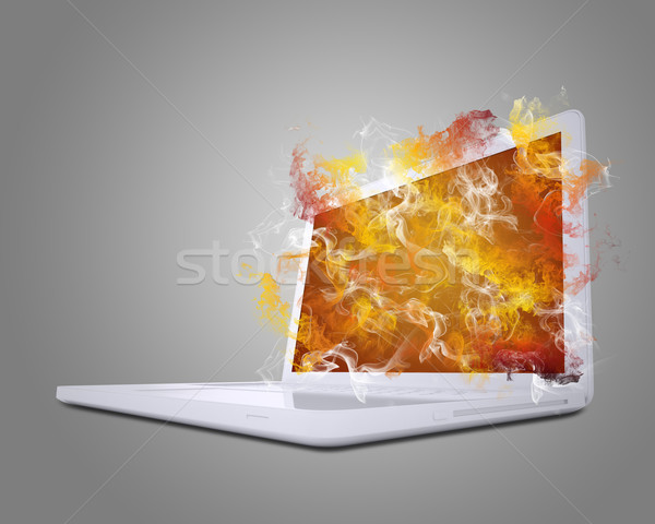 Open white laptop emits colored smoke Stock photo © cherezoff