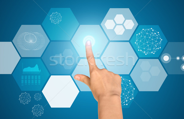 Humans arm touching virtual screen Stock photo © cherezoff
