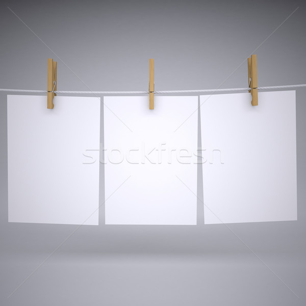Paper on a rope with clothespins Stock photo © cherezoff