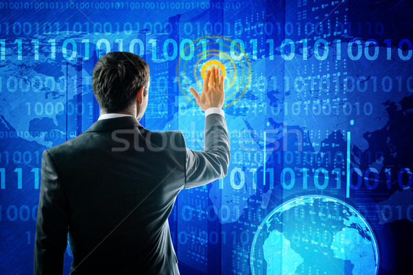 Businessman in suit pressing social media icon Stock photo © cherezoff