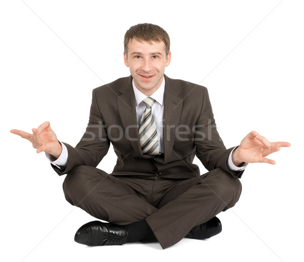 Businessman sitting in lotus posture Stock photo © cherezoff
