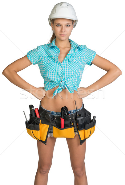 Pretty girl in helmet, shorts, shirt and tool belt with tools Stock photo © cherezoff