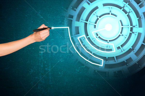 Womans hand writing on holographic screen Stock photo © cherezoff