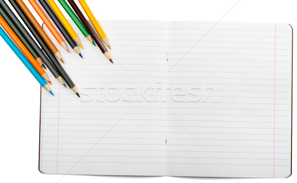 Abierto cuaderno establecer crayones aislado blanco Foto stock © cherezoff