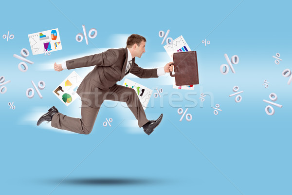 Businessman running forward Stock photo © cherezoff