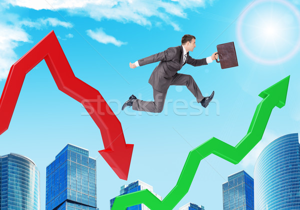 Businessman hopping arrows Stock photo © cherezoff