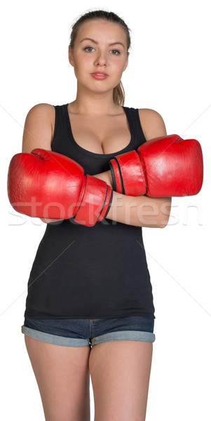 Woman in boxing gloves with her hands crossed on breast Stock photo © cherezoff