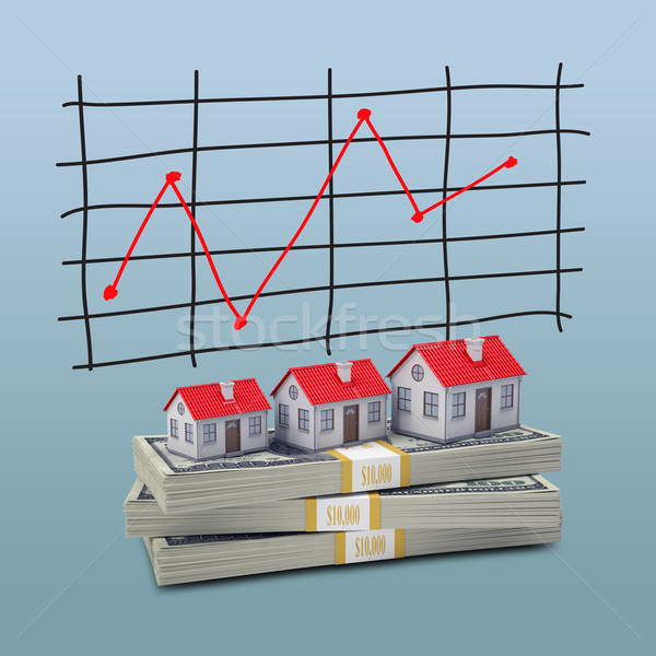 Stock photo: Small houses stand on pack of dollars