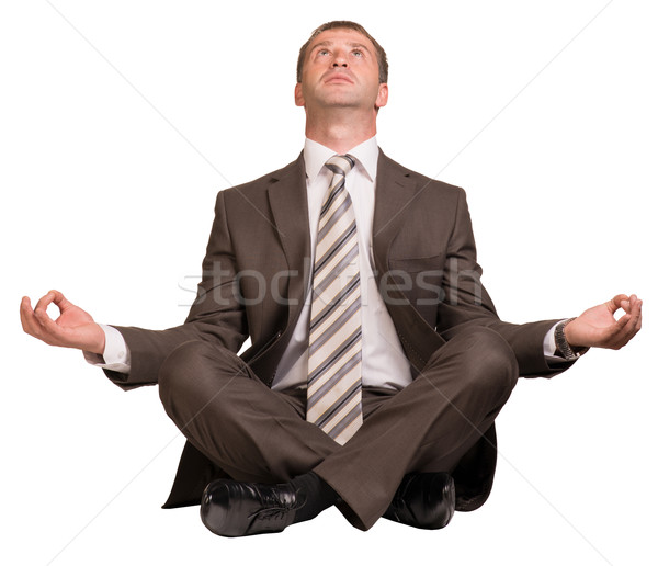 Businessman sitting in lotus position Stock photo © cherezoff