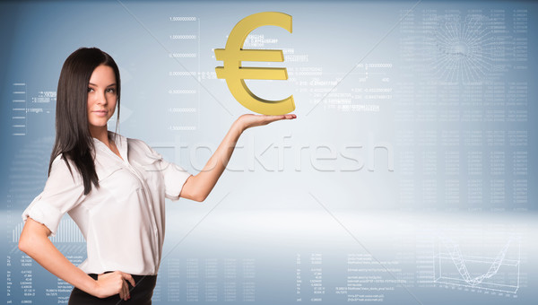 Beautiful businesswoman holding euro sign. Blue gradient background Stock photo © cherezoff