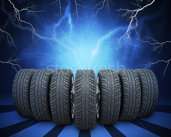 Wedge of new car wheels. Abstract background with lightning Stock photo © cherezoff