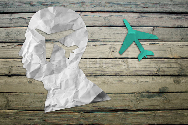 Paper humans head with jet symbol Stock photo © cherezoff
