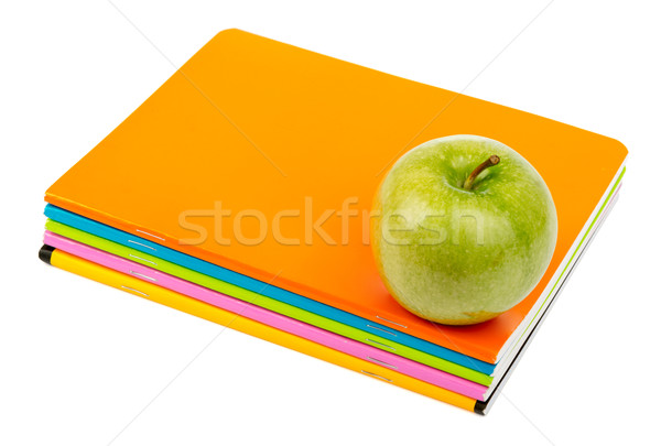 Fresh apple with copybooks Stock photo © cherezoff