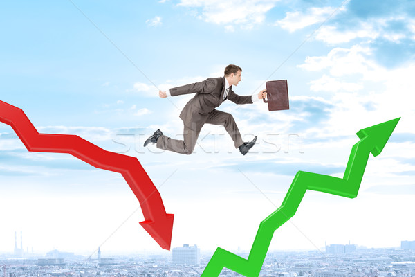 Businessman hopping arrows Stock photo © cherezoff