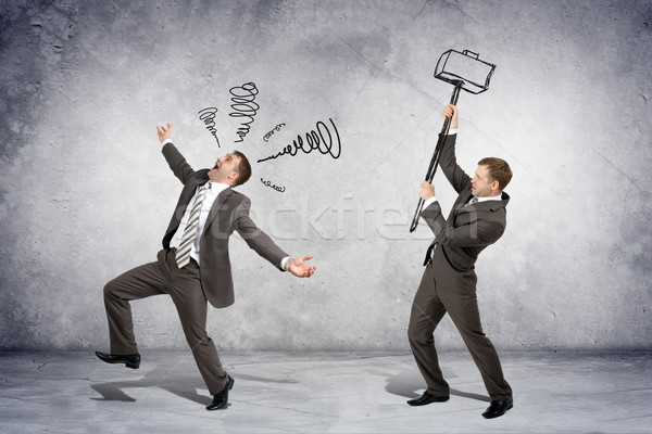Businessman hitting another man Stock photo © cherezoff