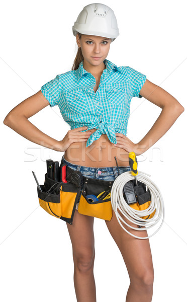 Woman in hard hat and tool belt posing Stock photo © cherezoff