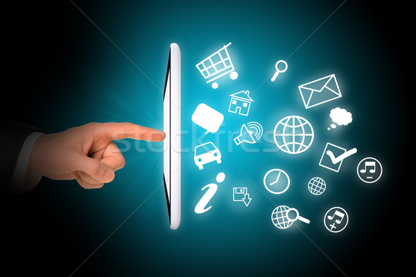 Tablet with icons and humans finger Stock photo © cherezoff