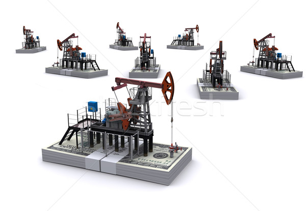 Stock photo: Oil pump-jacks stands on a packs of dollars