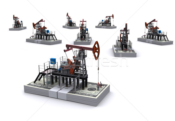 Oil pump-jacks stands on a packs of dollars Stock photo © cherezoff