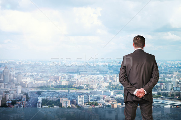 Businessman with crossed hands, back view Stock photo © cherezoff