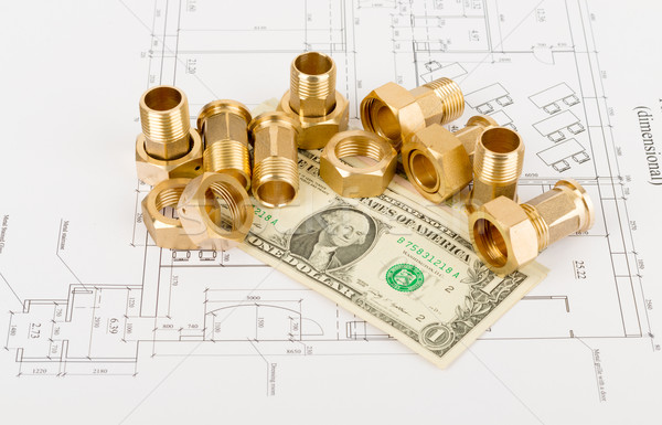 Pipe fittings with dollars on draft Stock photo © cherezoff